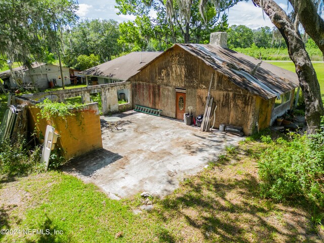 rear view of house featuring a patio