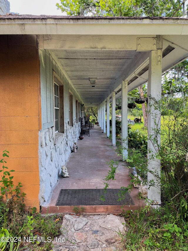 view of terrace featuring a porch