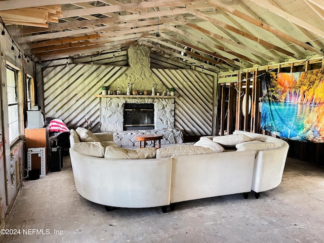 unfurnished living room featuring a fireplace and vaulted ceiling