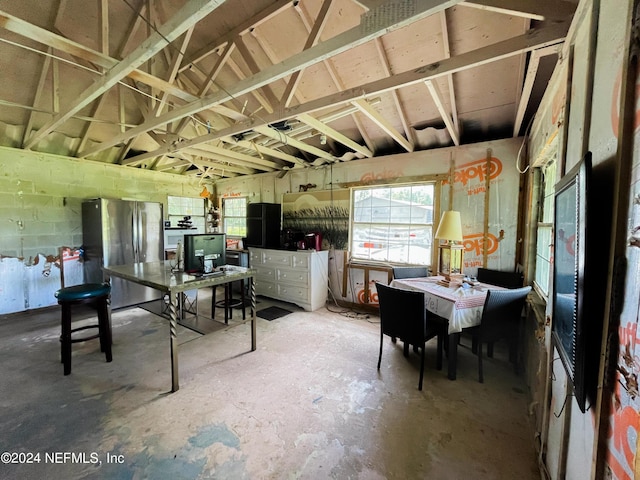 interior space with concrete flooring and concrete block wall