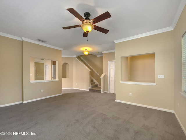 unfurnished living room featuring ceiling fan, dark colored carpet, and ornamental molding