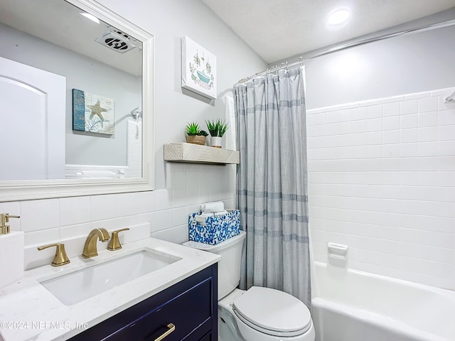 full bathroom with shower / bath combo, tasteful backsplash, toilet, vanity, and tile walls