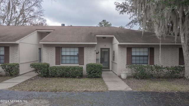 view of front of house featuring brick siding