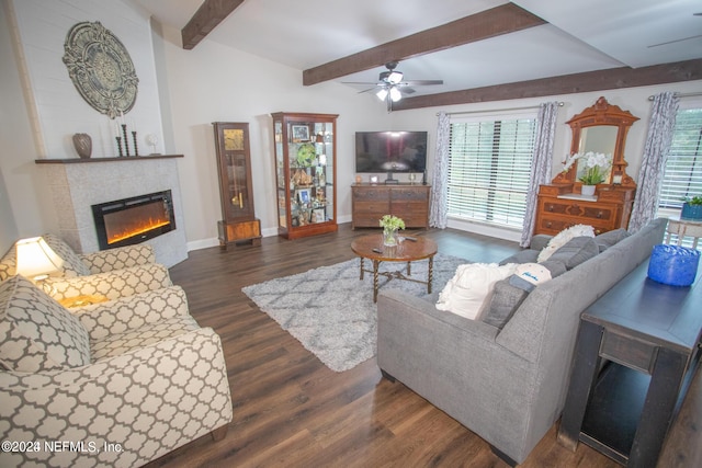 living area with baseboards, a ceiling fan, a tiled fireplace, dark wood-style flooring, and beam ceiling