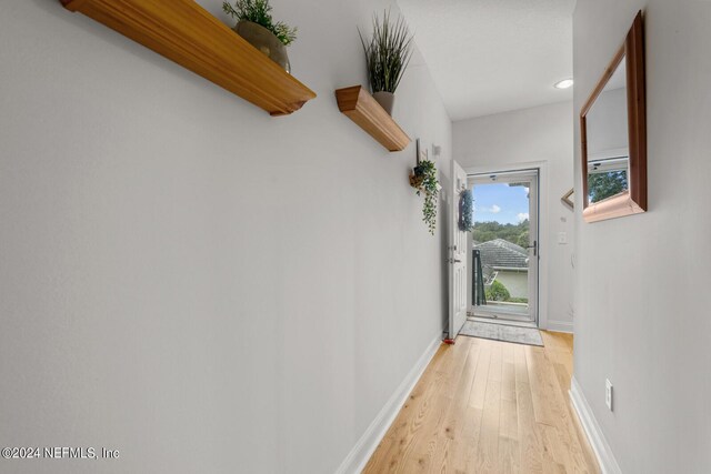 hallway featuring light wood-type flooring