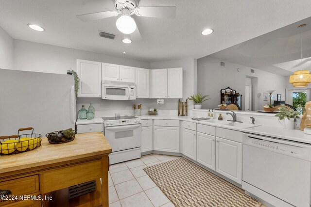 kitchen with ceiling fan, white cabinets, sink, white appliances, and light tile floors