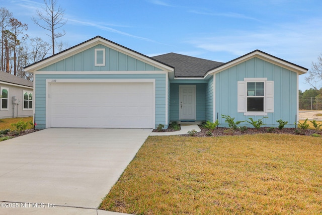 ranch-style home featuring a garage and a front yard