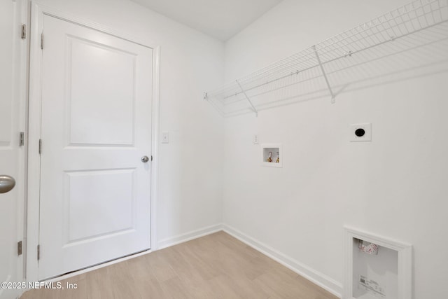 laundry area with hookup for an electric dryer, laundry area, washer hookup, baseboards, and light wood-style floors