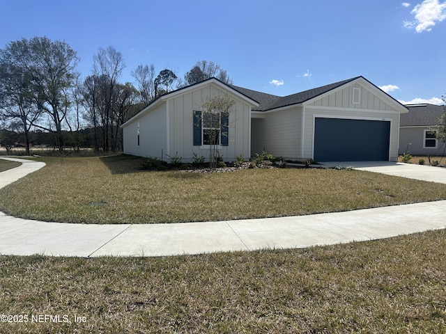 view of front of property with a front lawn, an attached garage, board and batten siding, and driveway