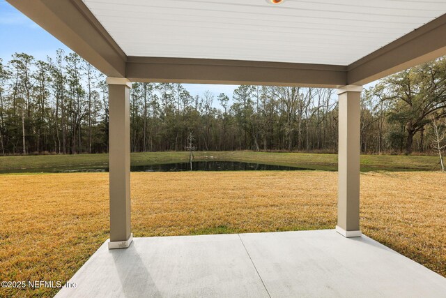 view of patio featuring a water view