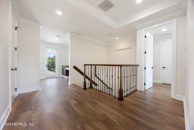 hallway with dark hardwood / wood-style flooring and crown molding