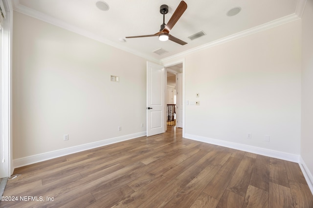 unfurnished room with ornamental molding and hardwood / wood-style flooring