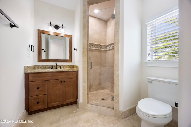 bathroom featuring vanity, toilet, and walk in shower