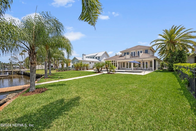 view of yard with a patio area and a water view