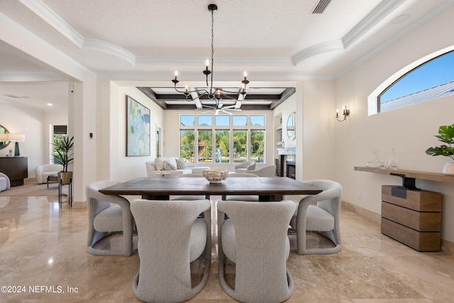 dining room with plenty of natural light, crown molding, and a notable chandelier