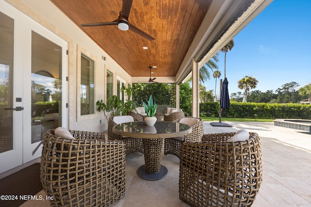 view of patio / terrace with ceiling fan and french doors