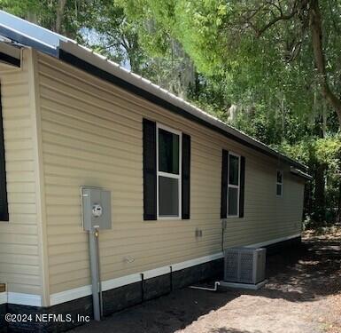 view of home's exterior featuring central AC unit