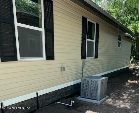 view of home's exterior featuring central AC unit