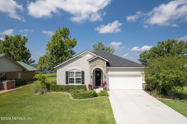 ranch-style house with a garage and a front yard