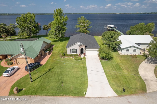 birds eye view of property featuring a water view