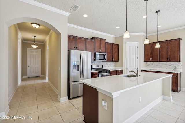 kitchen with sink, a textured ceiling, and appliances with stainless steel finishes