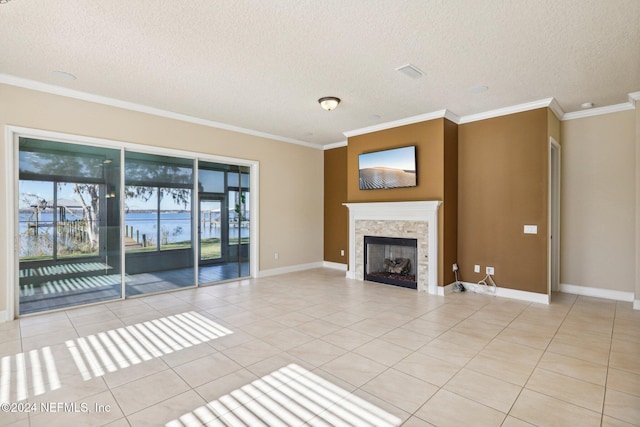 unfurnished living room with a fireplace, light tile patterned floors, and a textured ceiling