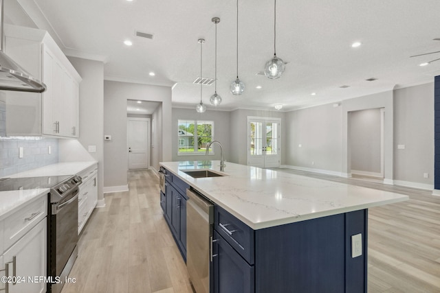 kitchen featuring white cabinets, electric range, sink, and light hardwood / wood-style floors