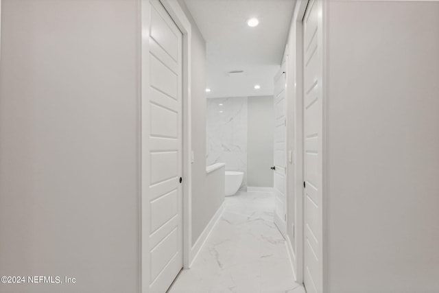 hallway with light tile flooring