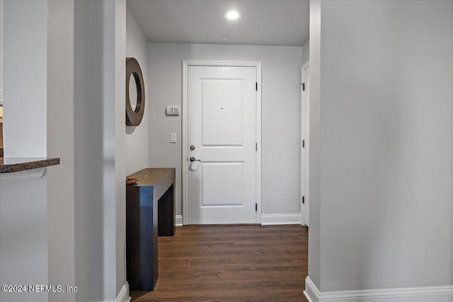 hall with dark hardwood / wood-style floors