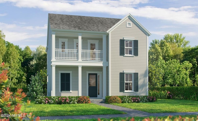 view of front of house featuring a front lawn and a balcony