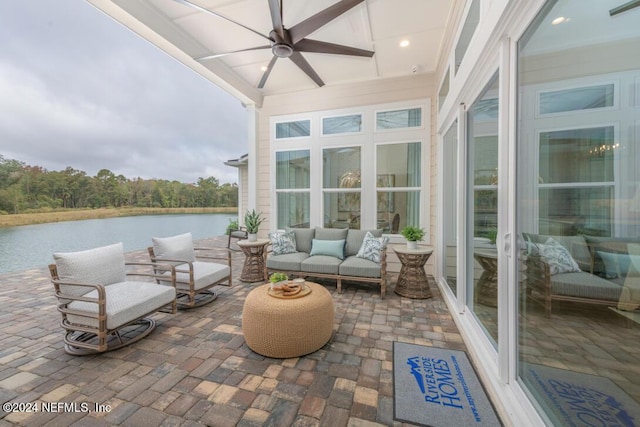 exterior space featuring a water view, ceiling fan, and visible vents