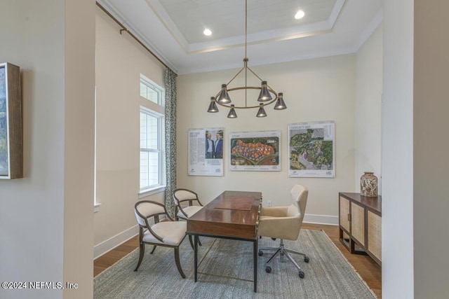 office featuring a tray ceiling, recessed lighting, wood finished floors, and baseboards