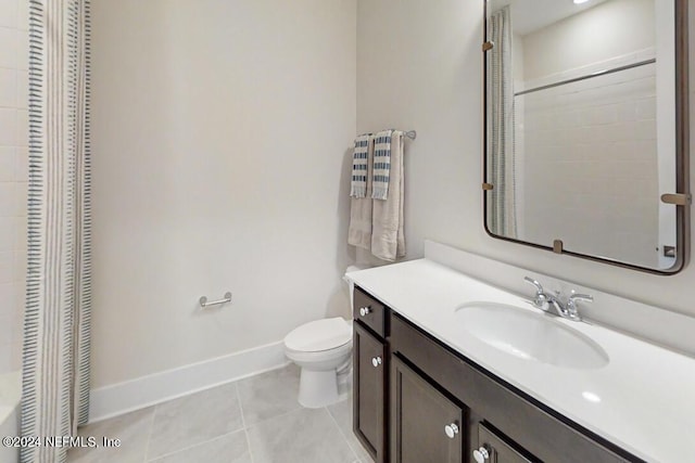 full bath with baseboards, toilet, a shower with curtain, tile patterned floors, and vanity