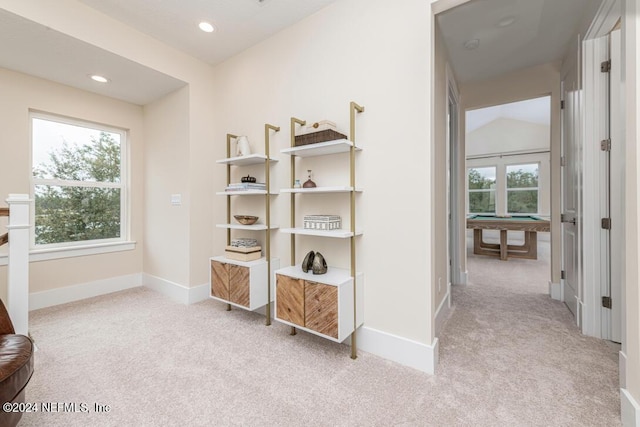 hall with carpet, baseboards, vaulted ceiling, and recessed lighting