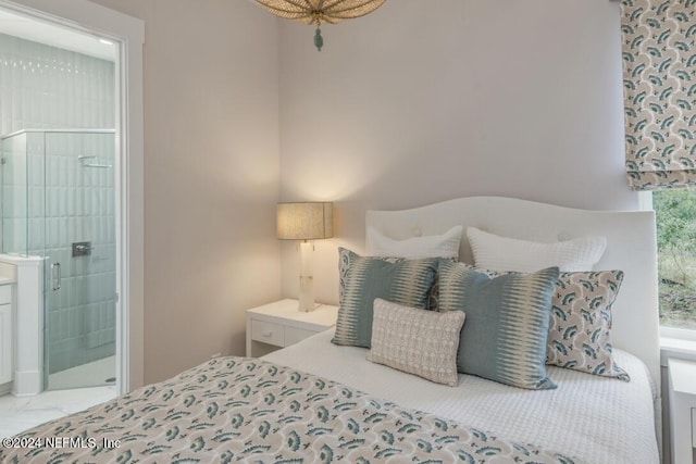 bedroom featuring ensuite bath