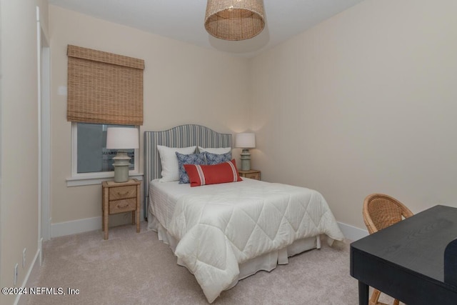 carpeted bedroom with baseboards