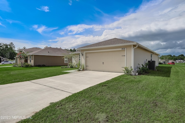 view of side of property featuring central AC, a yard, and a garage