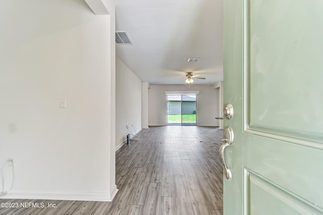 hallway with light wood-type flooring