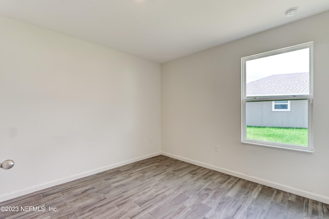 unfurnished room featuring light hardwood / wood-style floors