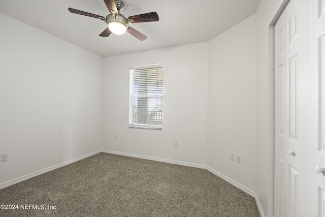 unfurnished bedroom with carpet flooring, a closet, and ceiling fan