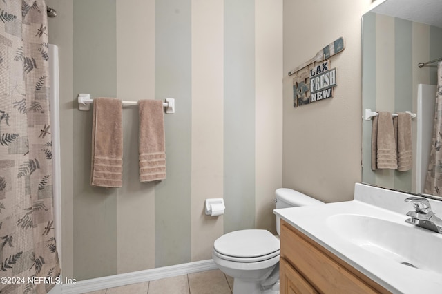 bathroom featuring walk in shower, tile patterned flooring, vanity, and toilet