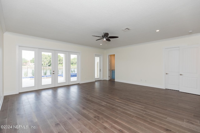 interior space with visible vents, baseboards, ceiling fan, ornamental molding, and dark wood-style flooring