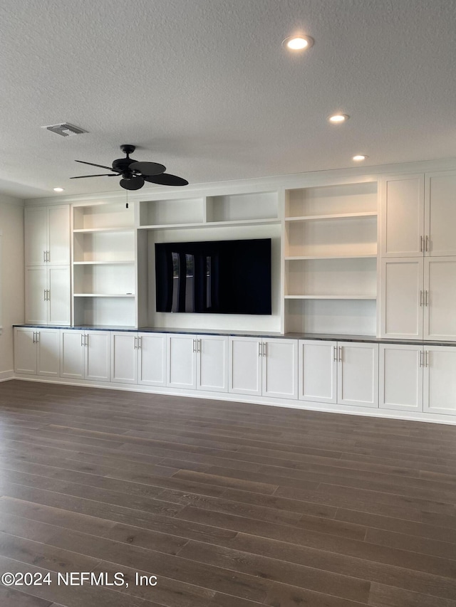 unfurnished living room with visible vents, a ceiling fan, dark wood-style floors, a textured ceiling, and recessed lighting