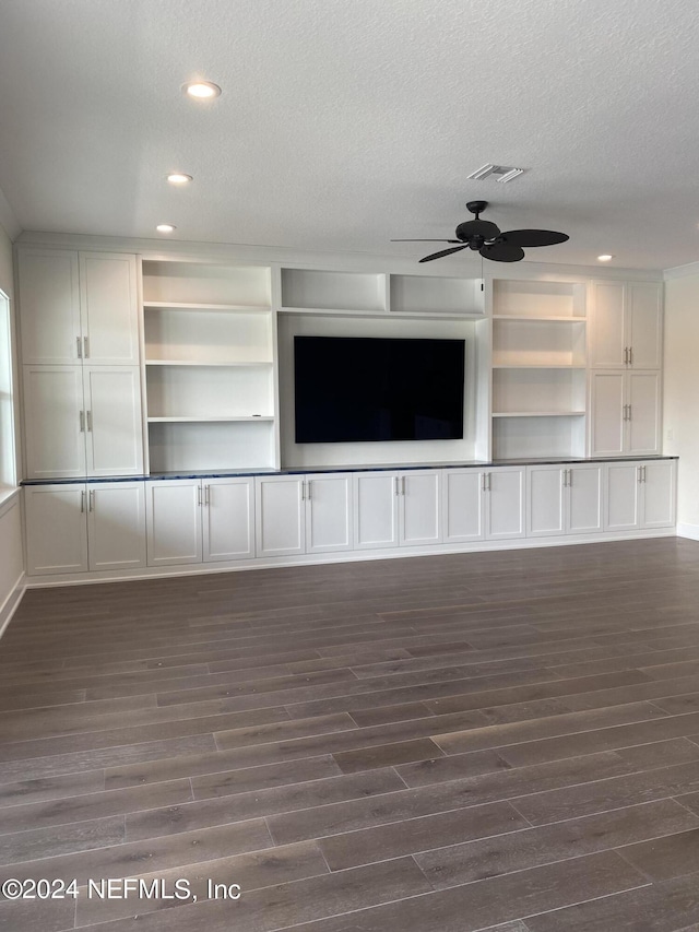 unfurnished living room featuring dark wood-style floors, recessed lighting, a textured ceiling, and a ceiling fan