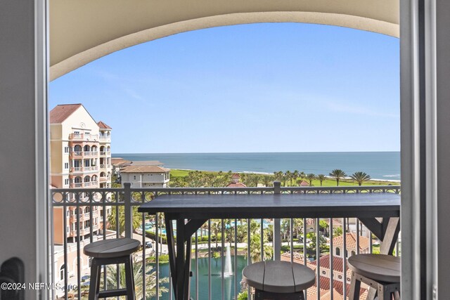 balcony featuring a water view