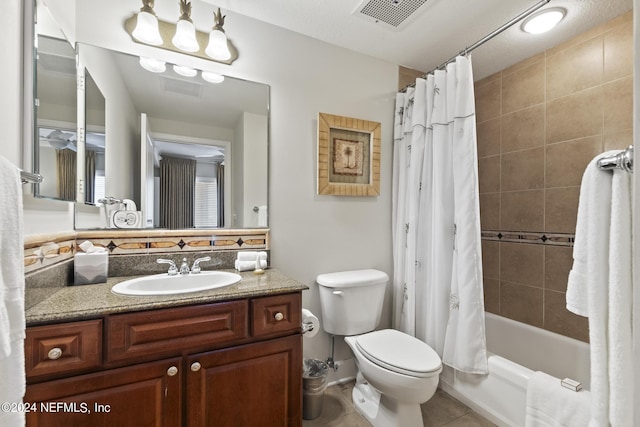 full bathroom featuring vanity, tile patterned flooring, shower / bath combination with curtain, and toilet