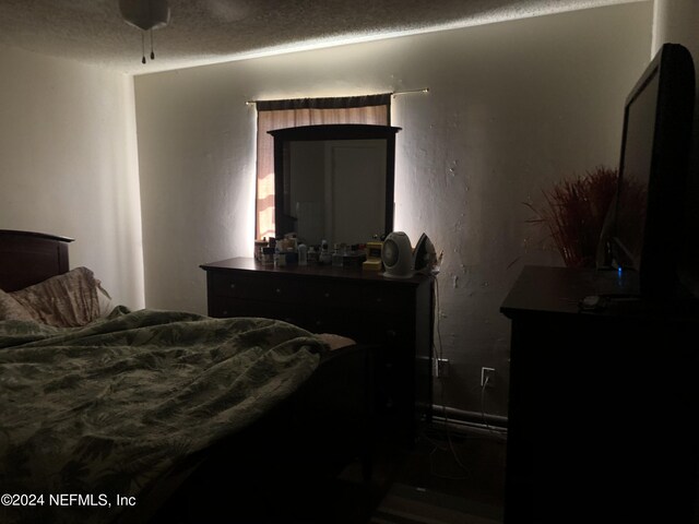 bedroom featuring a textured ceiling