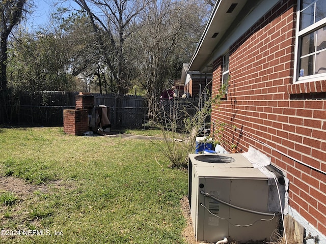 view of yard with central AC