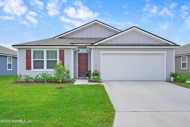 2035 Garrison Way, Green Cove Springs, FL 32043 - view of front of home with a garage and a front yard