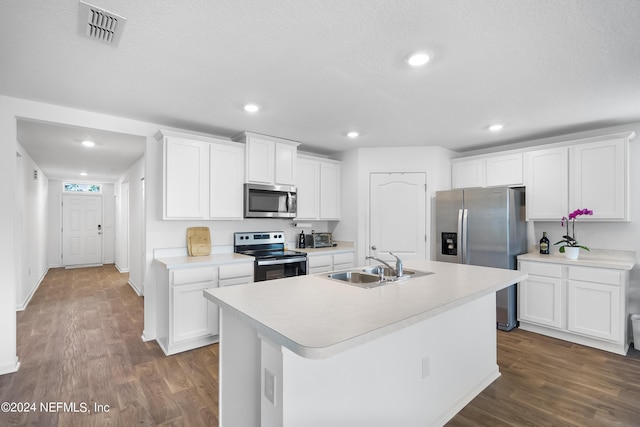 2035 Garrison Way, Green Cove Springs, FL 32043 - kitchen featuring appliances with stainless steel finishes, dark wood-type flooring, a center island with sink, and white cabinets
